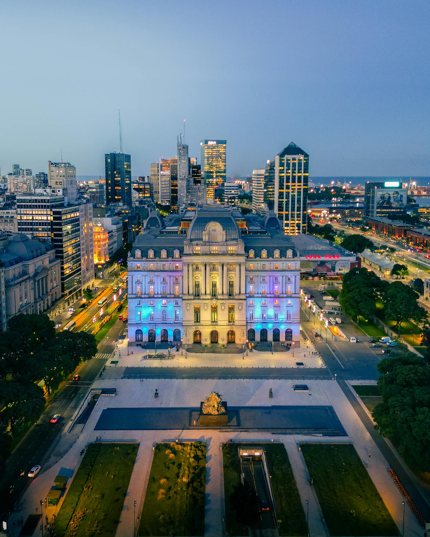 Stunning aerial view of Buenos Aires cityscape with illuminated palace at night.